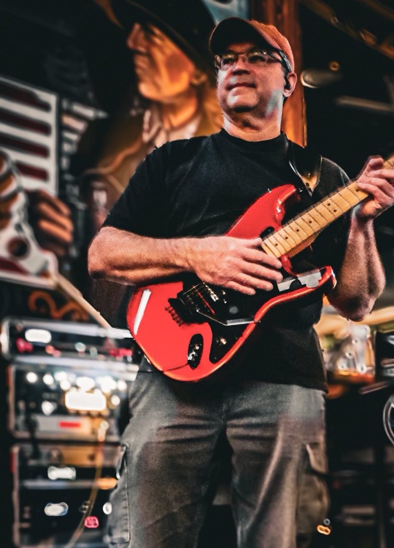Steve Davis performing live on guitar